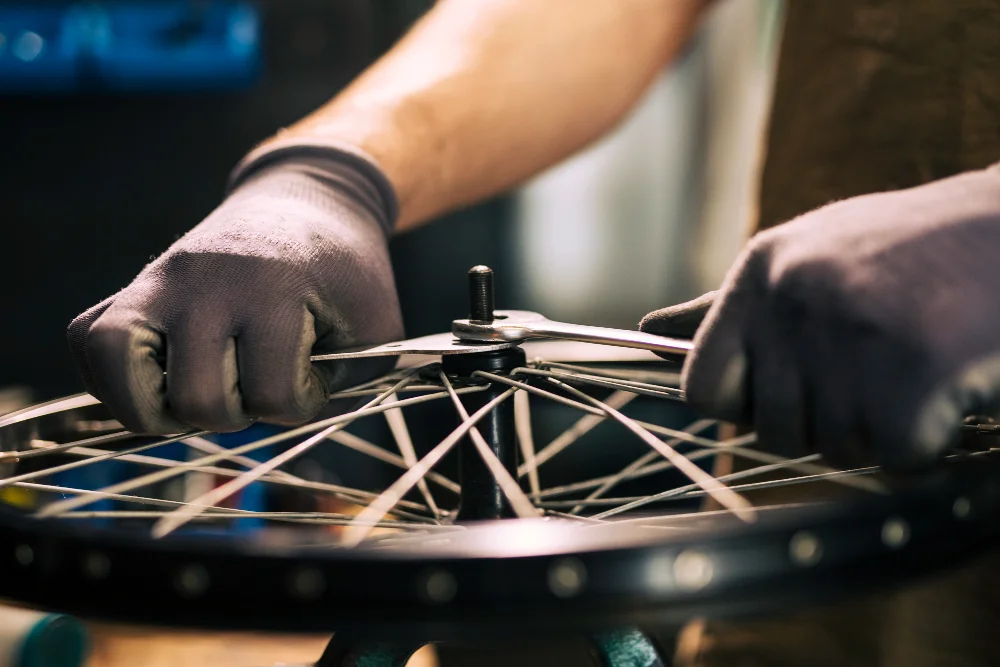 Mechanic repairing bicycle