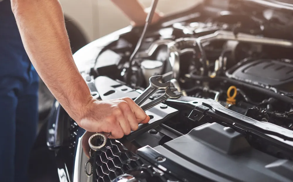 Car Service Worker Repairing Vehicle